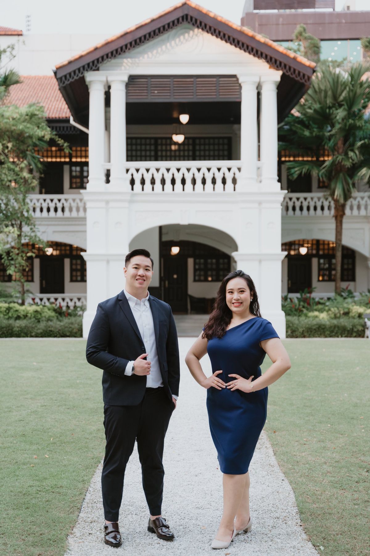 Keith Lim and Rachel Tan standing in front of a colonial black and white building
